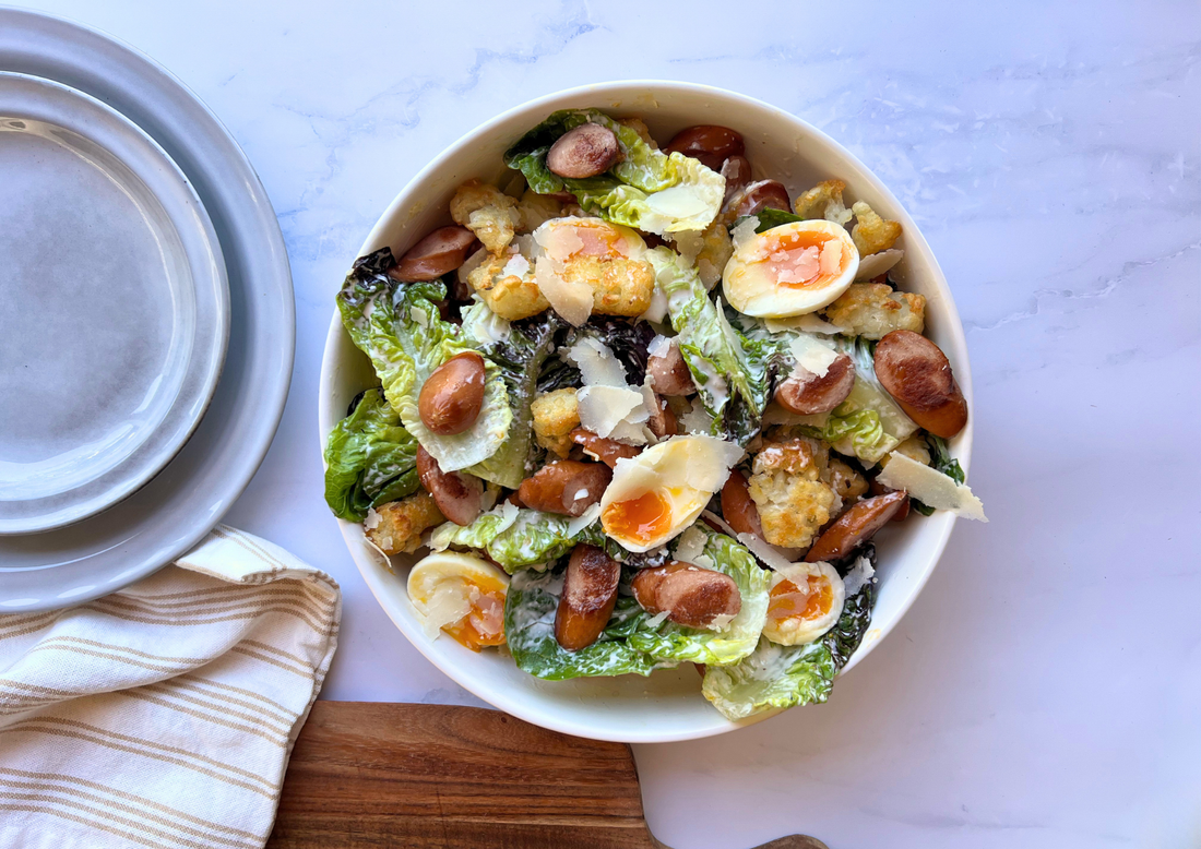 Caesar Salad with Crispy Continental Franks and Potato Gems