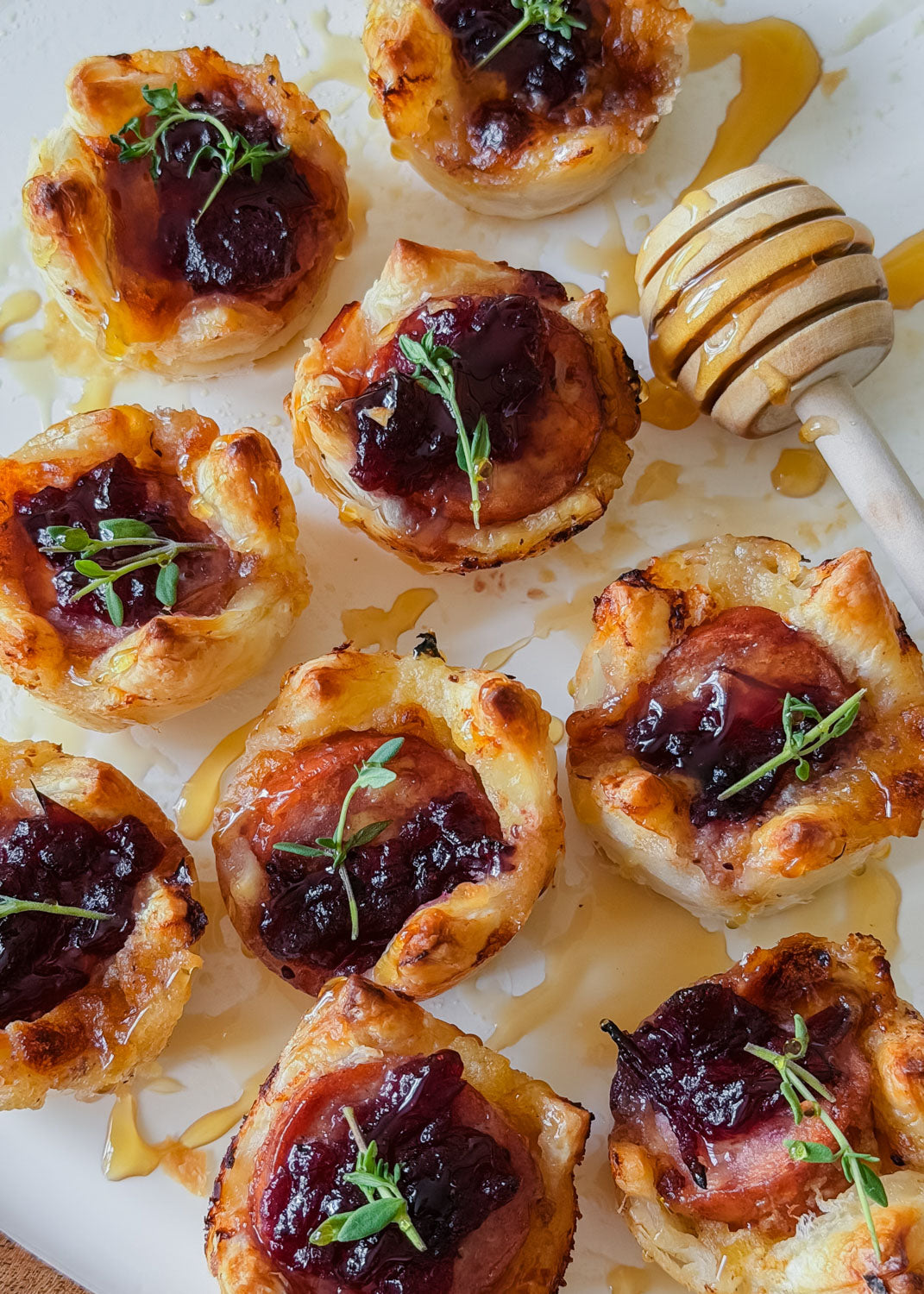 Smoked Kabana, Cranberry & Brie Pastry Bites with Hot Honey Drizzle by @justflavourco