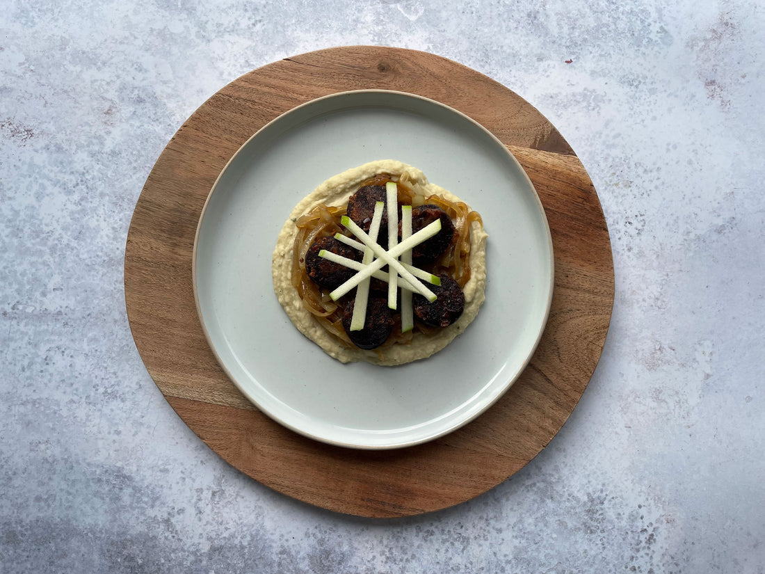 Black Pudding Served with Butter Bean Puree and Apple Cider Braised Onions